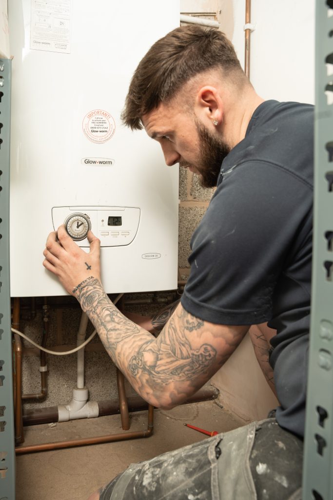 plumber working on a boiler